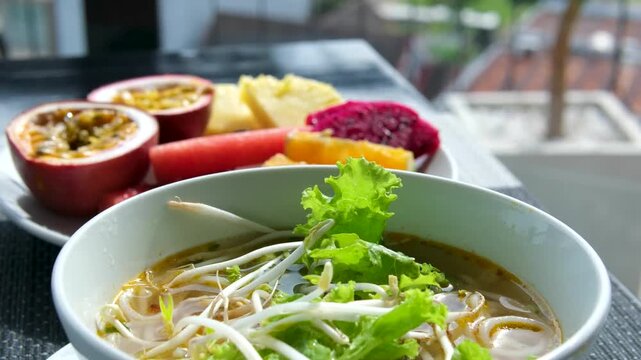 Vietnamese pho soup vermicelli soup on the street small eatery cooking fa soup in Vietnam street food dirt delicious travel tourists local population.