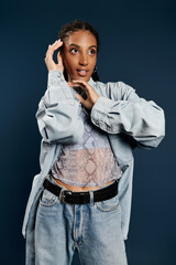 Fashionable young woman showcases trendy style against a dark backdrop in a modern setting