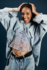 Fashion forward young woman showcases casual style in a vibrant setting during a studio shoot