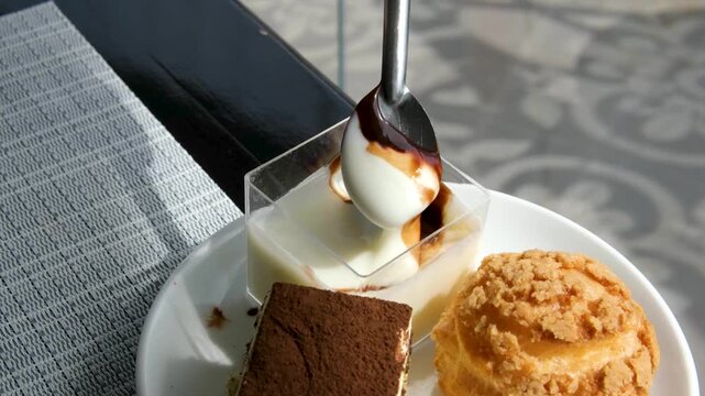 Three types of dessert, creme brulee, tiramisu, and custard, yogurt with chocolate. High quality 4k footage