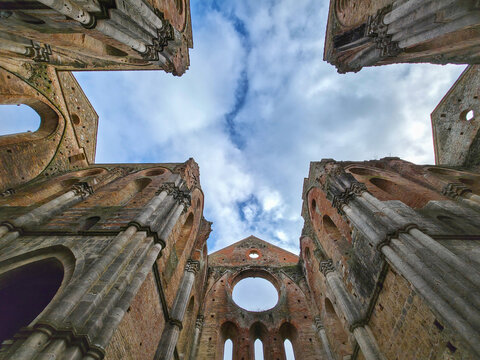 Low Angle View of Roofless Gothic Arches and Sky in San Galgano Abbey, Tuscany, Italy