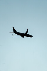 Commercial airplane in blue sky minimal aviation concept, Vertical