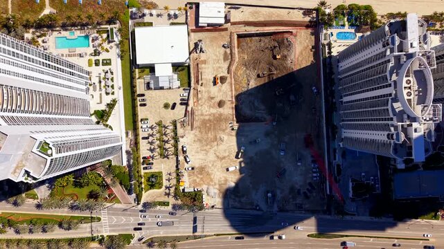 Flying over a co,nstruction site Sunny Isles Beach 180th St and Collins Avenue