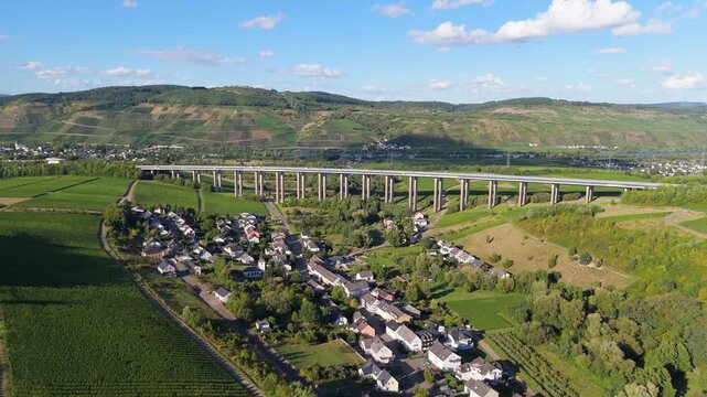 Moselle Viaduct Longuich, vineyard in Mosel valley, bridge of highway crossing river near Trier, german autobahn, aerial view