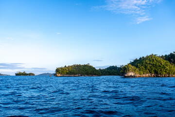 Sunset over Waleakodi Island, Togian archipelago, Sulawesi, Indonesia coastal landscape