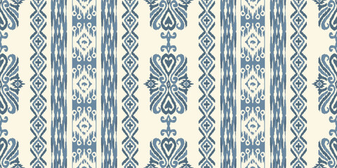 Abstract ethnic ikat background. Ethnic seamless pattern in tribal. Fabric Mexican style. Design for wallpaper, vector illustration, fabric, clothing, carpet, textile, batik, and embroidery. © supachai
