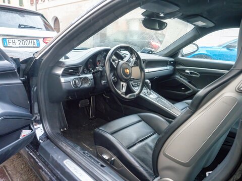 Porsche Carrera 4S interior view showing luxurious leather seats and dashboard