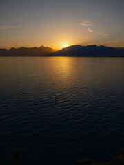 Scenic sunset view with mountains and serene ocean