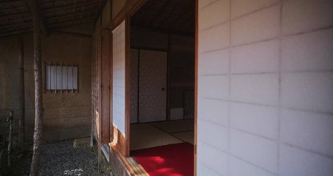 Ancient Japanese building with paper sliding door - slow motion steady cam shot