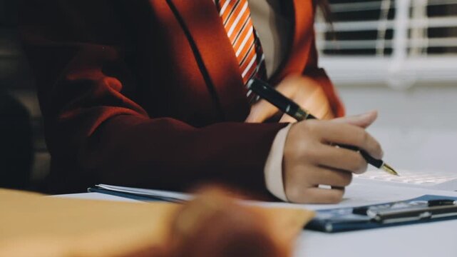 justice and law concept.Male judge in a courtroom on wooden table and Counselor or Male lawyer working in office. Legal law, advice and justice concept.