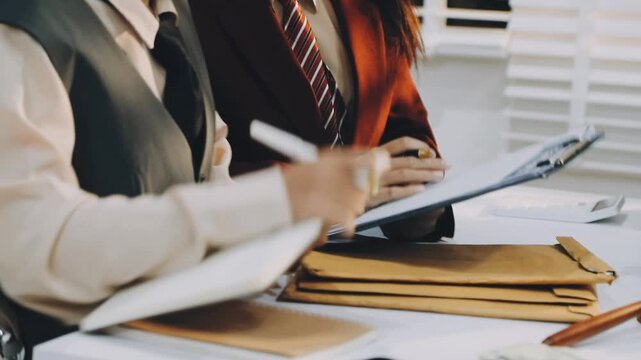 justice and law concept.Male judge in a courtroom on wooden table and Counselor or Male lawyer working in office. Legal law, advice and justice concept.