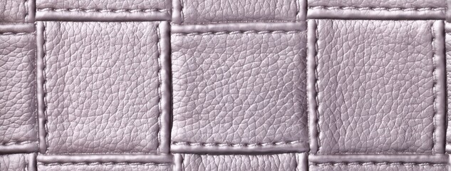Fototapeta premium Texture light gray leather background with quilted stitched pattern, macro. Abstract silver upholstery surface