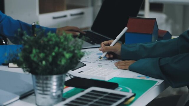 Business leaders discuss implement environmental sustainability strategies net zero carbon goals corporate responsibility using ESG reports data at meeting