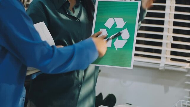 Business leaders discuss implement environmental sustainability strategies net zero carbon goals corporate responsibility using ESG reports data at meeting