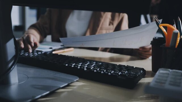 Doing finance, budgeting and tax calculation. Close up woman hand using calculator to calculate home finance, accounting with laptop computer on table, budget management, monthly expenses.