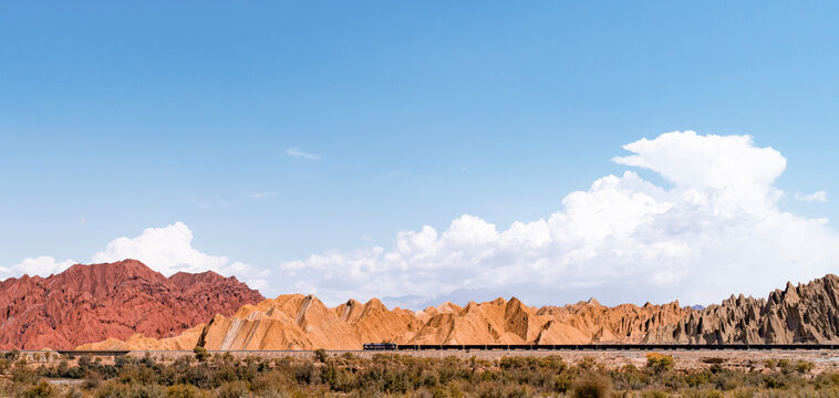 The train passes through the colorful stone mountains