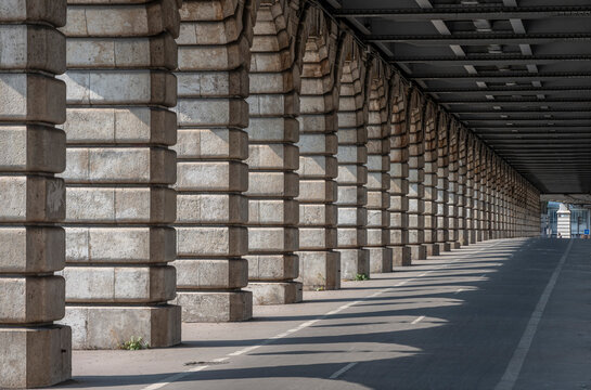 Paris, France - 08 15 2025: Graphical detail view of the arches of the Bercy Bridge