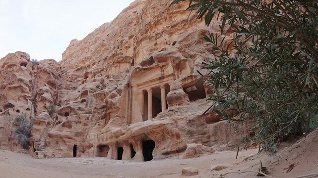 Timelapse Little Petra Siq al Barid Nabataean Triclinium rock cut dining hall carved in sandstone cliffs archaeological site near Petra Jordan