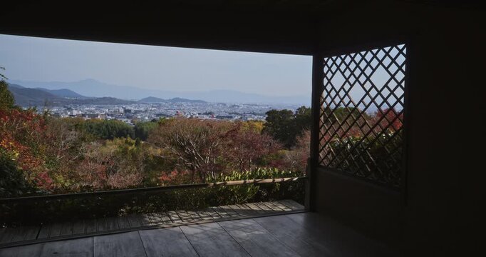 Steady movement inside old Japanese room to open doors and view of autumn valley