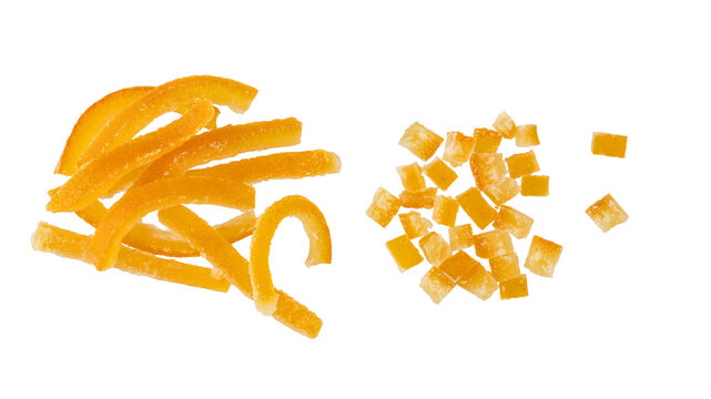 Candied orange peel pieces with sugar and slices flying isolated on white. Healthy dessert with fiber and vitamin.