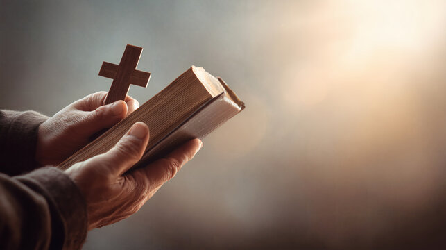 Hands Holding Holy Bible with Wooden Cross Spiritual Concept