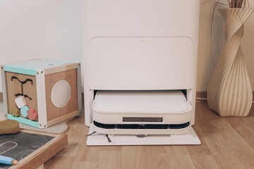 Robot vacuum docked at charging station