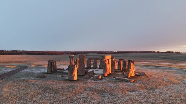 A drone view of snow-covered Stonehenge and the Wiltshire countryside in England, UK. The stone circle dates back to 3000 BC and is one of the most famous ancient wonders of the world and a UNESCO