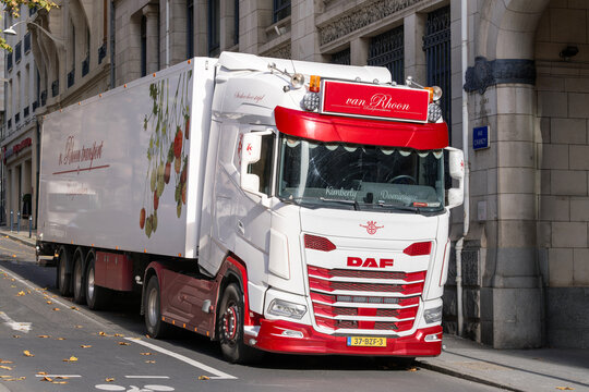 Nancy, France - November 12th 2025 : View on a white and red truck DAF XG 480 FT with a semi-trailer parked in a street for a delivery with Art Nouveau buildings in the background.
