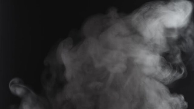 Steam, smoke, vapor isolated on black background. Smoke steam spray, abstract vaporing water, texture of cold mist, hot vapor, fog effect closeup, black screen.  