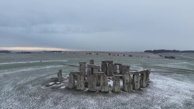 A drone view of snow-covered Stonehenge and the Wiltshire countryside in England, UK. The stone circle dates back to 3000 BC and is one of the most famous ancient wonders of the world and a UNESCO