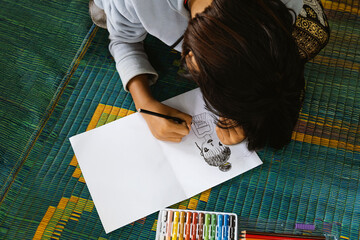 Child Drawing with Colored Pencils Creative Learning and Art Education Concept