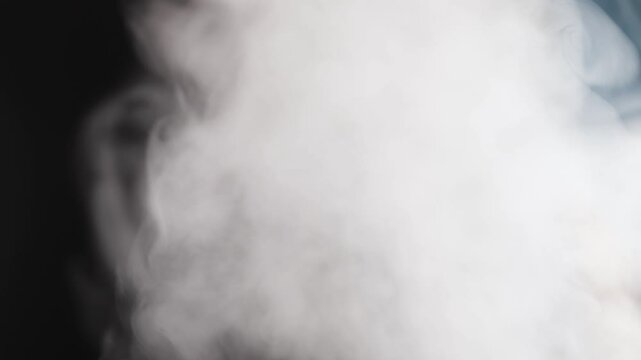 Steam, smoke, vapor isolated on black background. Smoke steam spray, abstract vaporing water, texture of cold mist, hot vapor, fog effect closeup, black screen.  