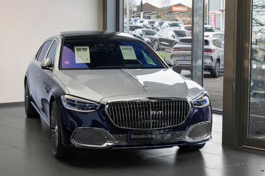 Nancy, France - January 31st 2026 : View on a grey and blue Mercedes-Maybach S 680 finished in Nautical blue and High-tech silver in a showroom.