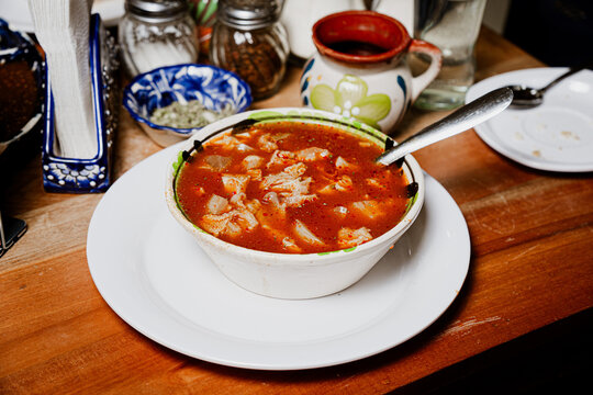 Menudo caliente on a table, a Mexican dish