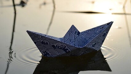 Paper Boat Floating on Water Surface.