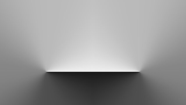 A minimalist white shelf is mounted on a grey gradient wall, illuminated by a strong overhead light that casts a sharp shadow below.