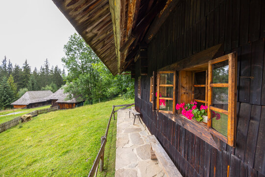 Traditional Slovak wooden house with flowers in Zuberec