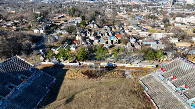 Aerial drone photo of Herndon Stadium in Atlanta, Georgia, capturing the historic sports venue from a dynamic high-angle perspective. The image highlights the stadium&rsquo;s oval design, surrounding campus