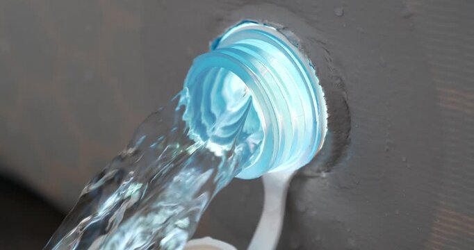 Water drains from frame pool. Draining water from outdoor open-air swimming pool. Water is leaking from the tank
