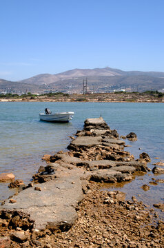 A single boat moored on the island of Antiparos, Greece