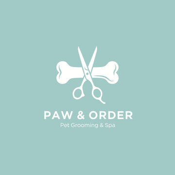 Pet grooming logo featuring scissors and bones design