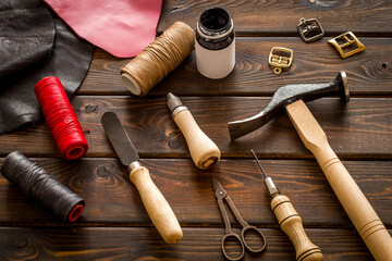 Leather craft work tools flat lay. Tailor or shoemaker on workplace, top view