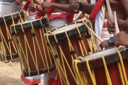 chendamelam, Chenda is a traditional percussion instrument originating from Kerala, India, used in temple rituals, classical dance forms like Kathakali, and other cultural festivities.