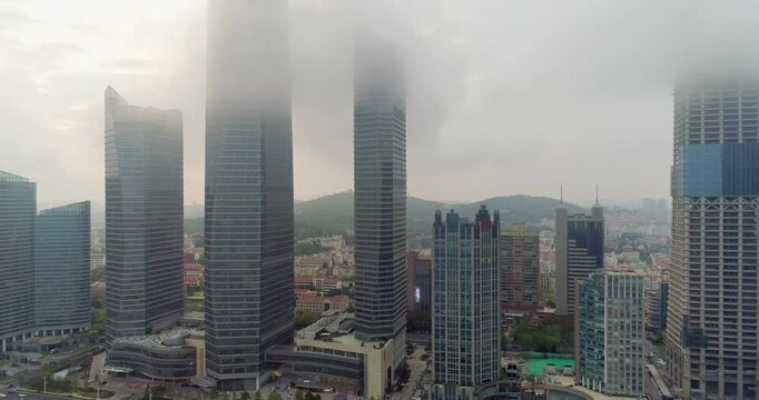 Aerial photos of city buildings in fog by drone