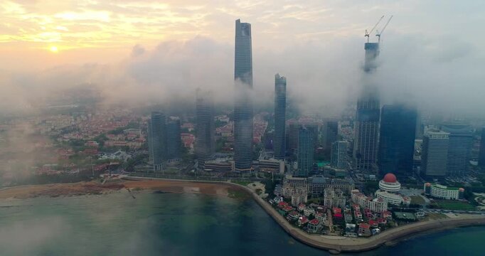 Aerial photos of city buildings in fog by drone