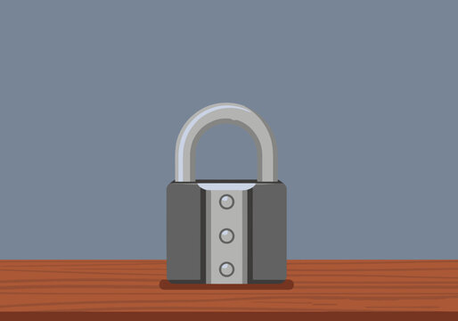 A heavy-duty titanium steel lock secures a metal lock on a wooden surface.  Bold, secure design. Ideal for security and protection concepts.