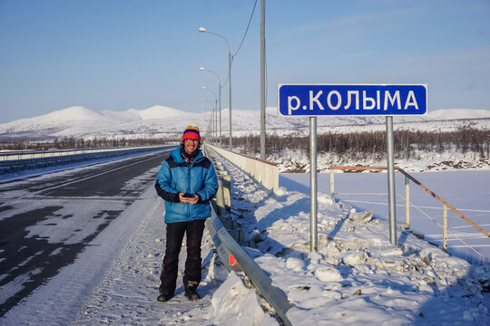 A guy near the Kolyma River sign