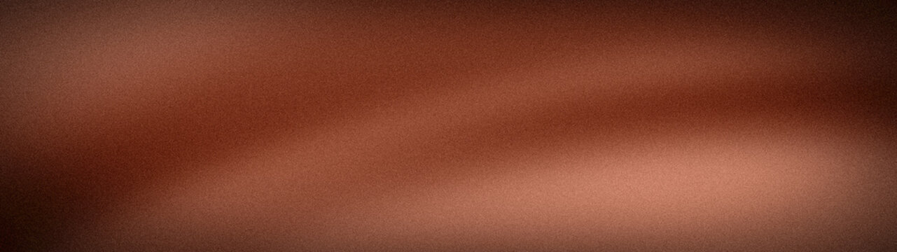 Abstract wide grainy background with deep brown, copper, and mahogany tones. Richly textured blurred gradient perfect for warm banners and earthy wallpapers