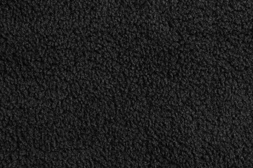 Black teddy bear texture fabric background © Anna