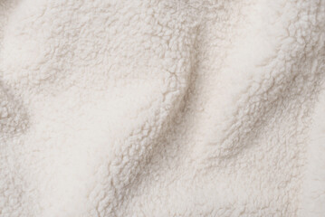 White teddy fabric background, soft curly texture